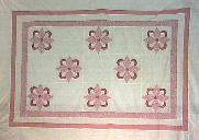 Pink appliqued quilt